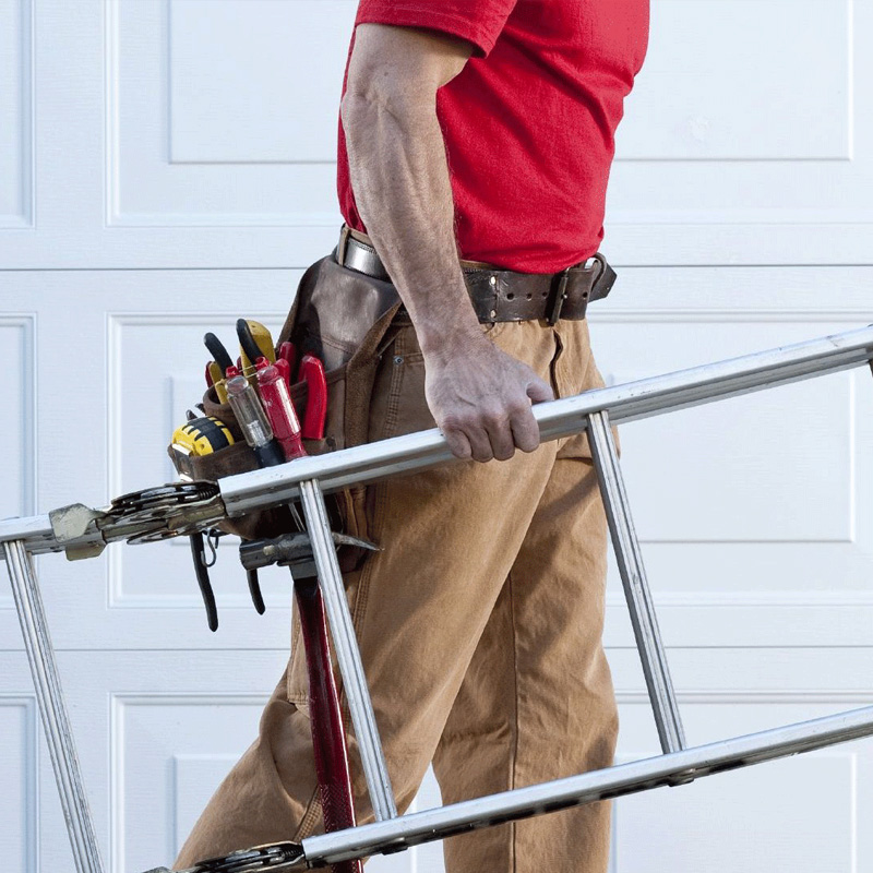 Repairman carrying a ladder